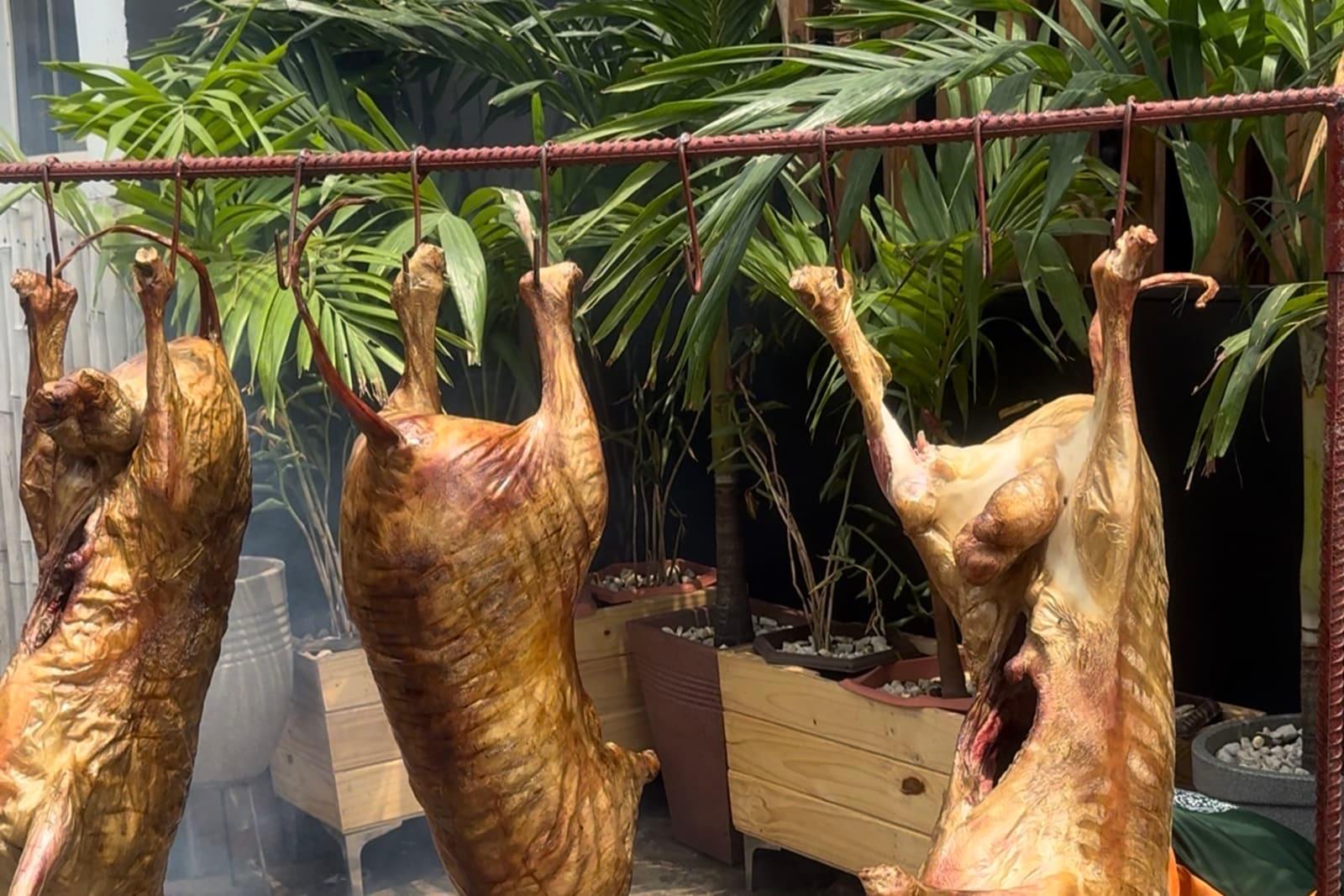 Whole roast ram on the fire